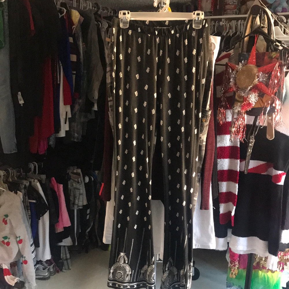 Juniors black/white leggings, with slight flare size medium